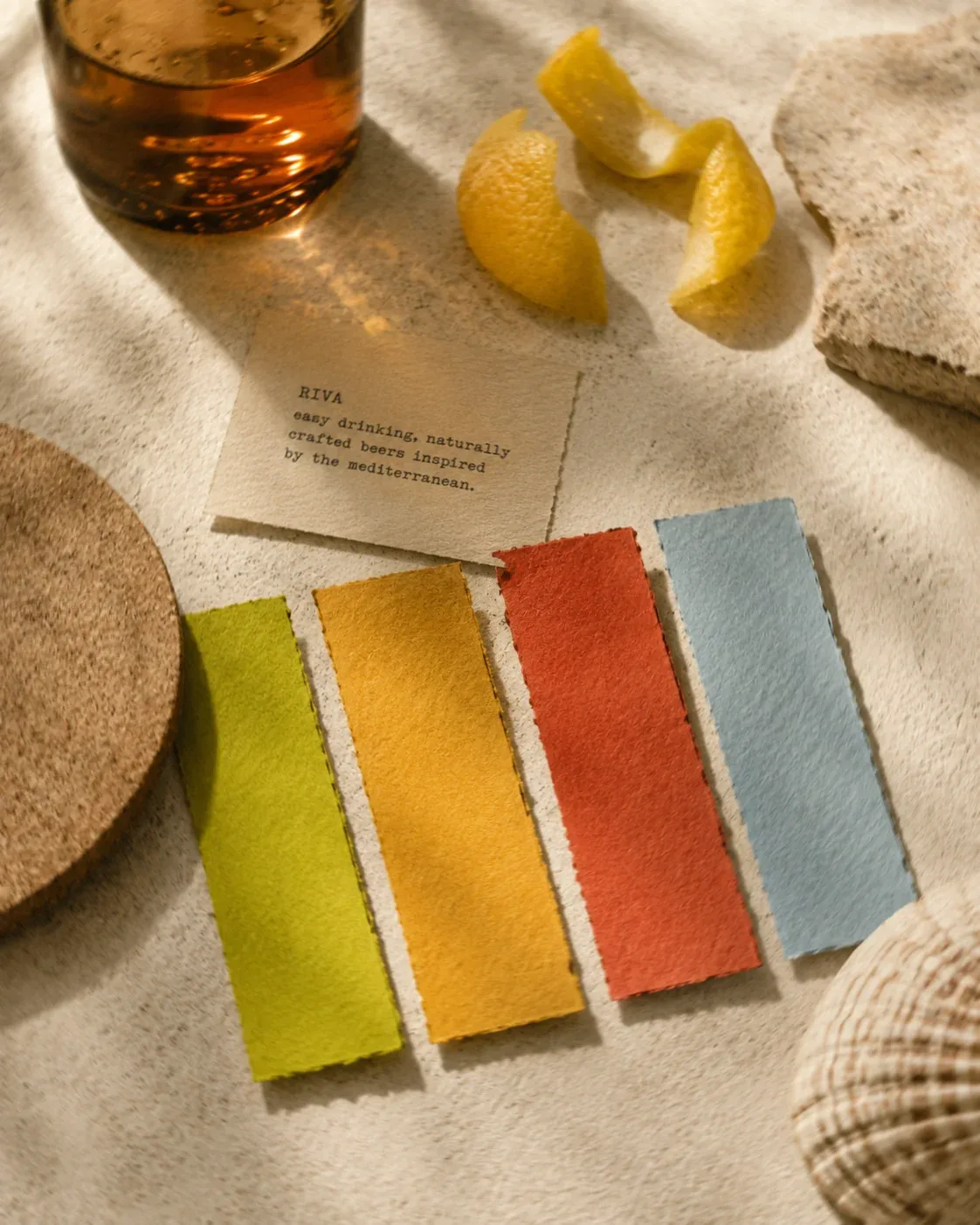 Riva bottle, coasters and tasting card arranged for social content