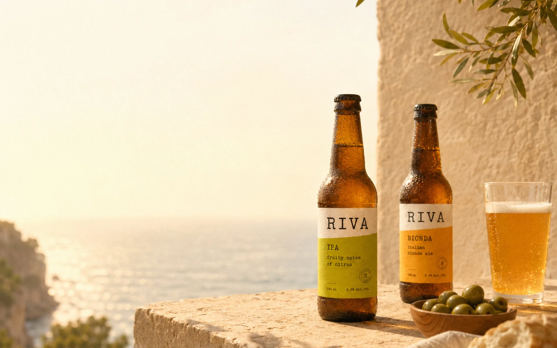 Two Riva beers and a glass in golden coastal light